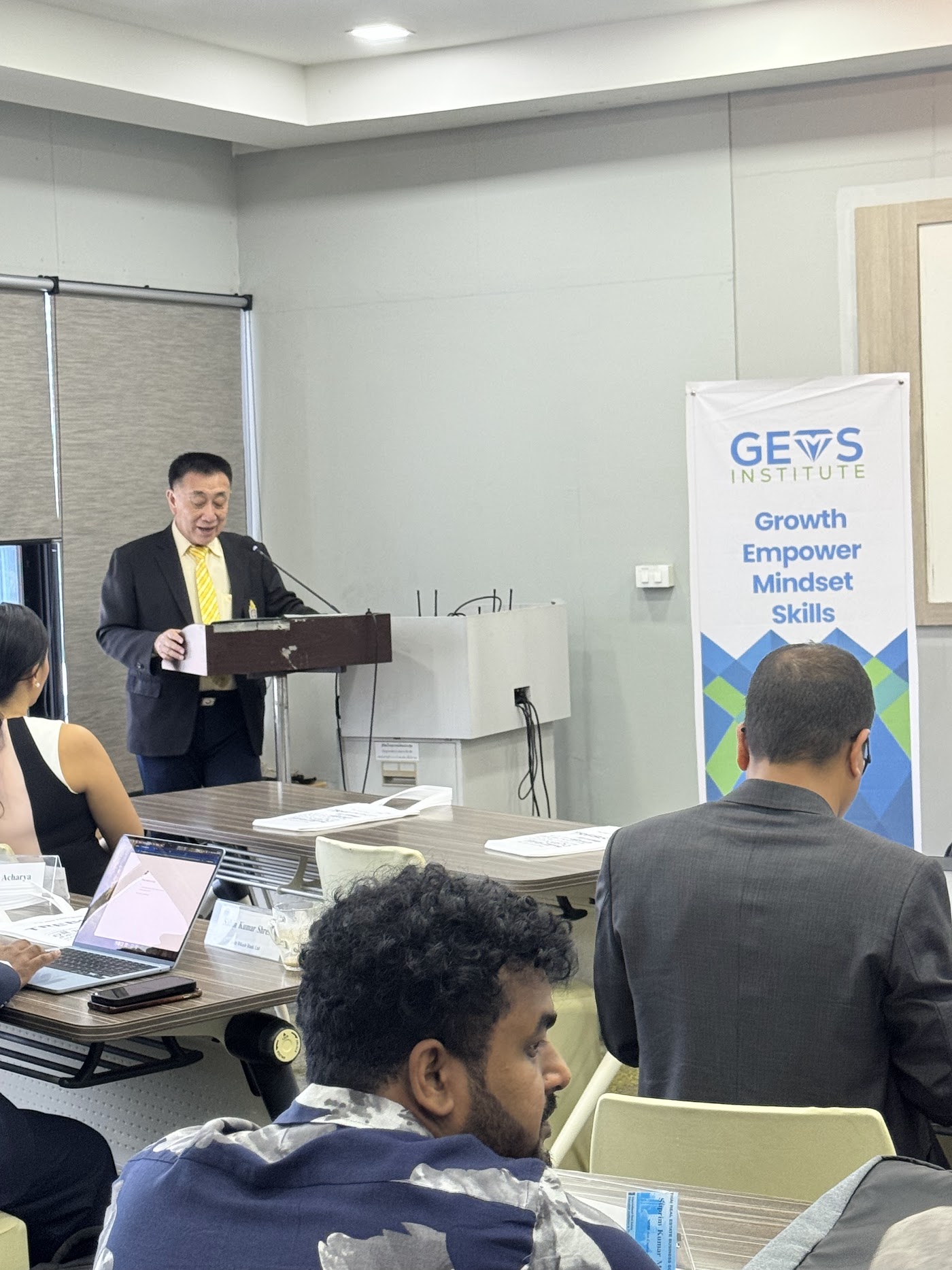 A facilitator leading a GEMS training session