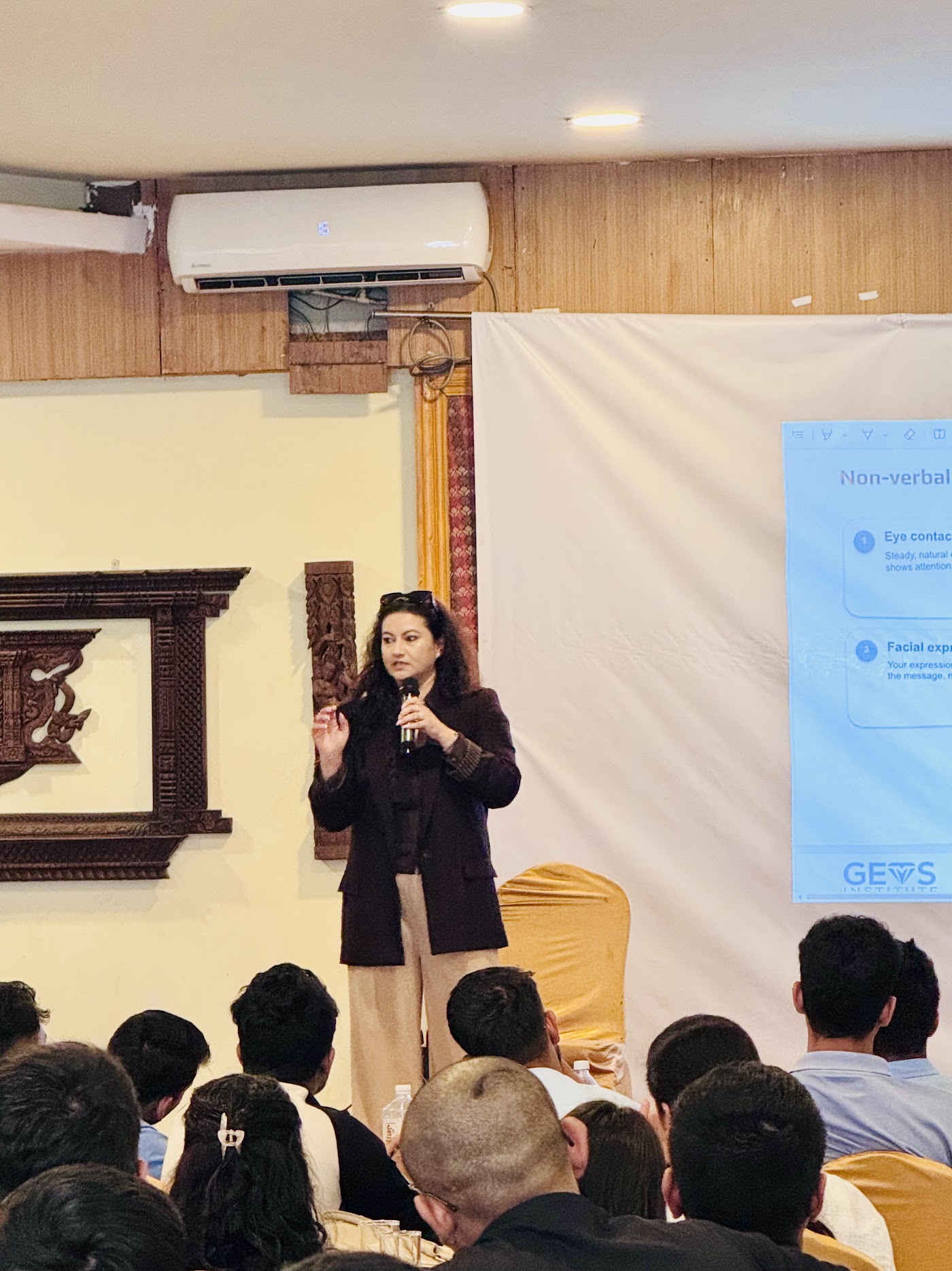 A facilitator leading a GEMS training session